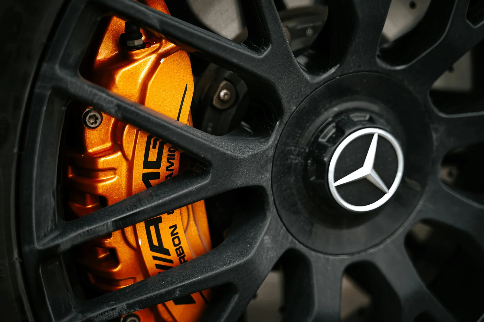 Orange performance brake caliper and wheel — The Auto Surgeon